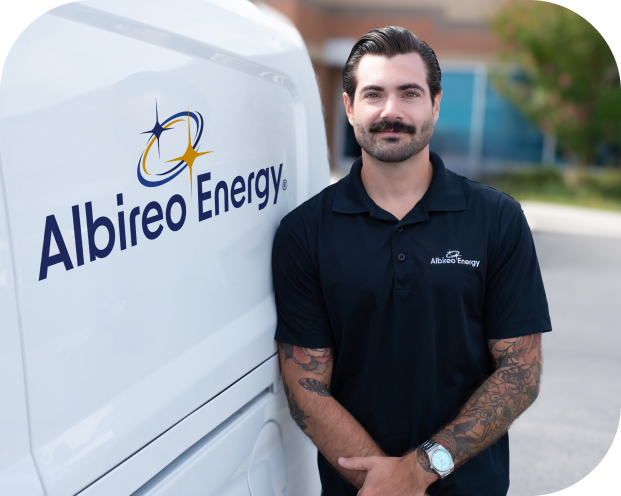 Albireo Energy employee in front of a work truck.