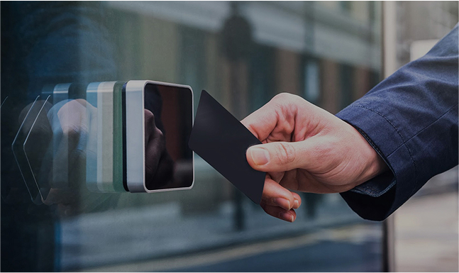 A person swiping a keycard.