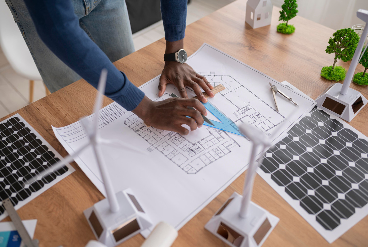 for-life-of-building-image Person working with building floorplan